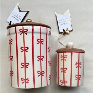 Ceramic holiday canister with red vertical stripes and bows